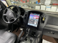 Магнитола для Mitsubishi Pajero 4 2006-2022 - Carmedia ZF-1302-GE вертикальный экран в стиле "Тесла" на Android 13, 8Гб+128Гб, CarPlay, 4G SIM-слот